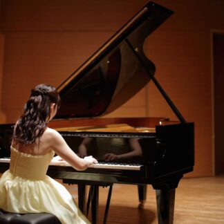 a woman playing a piano